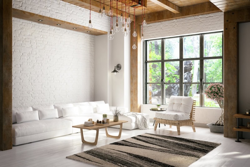 Loft room with cozy design with a central air conditioner cooling the home.